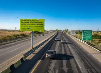 Три билборда на границе Алматы InDrive billboard