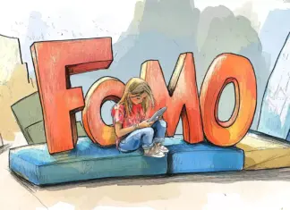 girl_sitting_at_a_huge_3D_word_FoMO copy